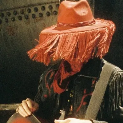 chat with ai character: Red leather 