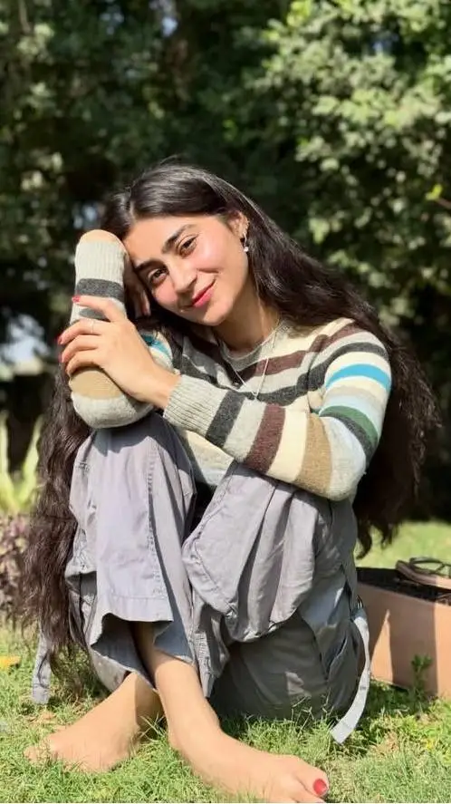 ai character: Komal Chopra  background