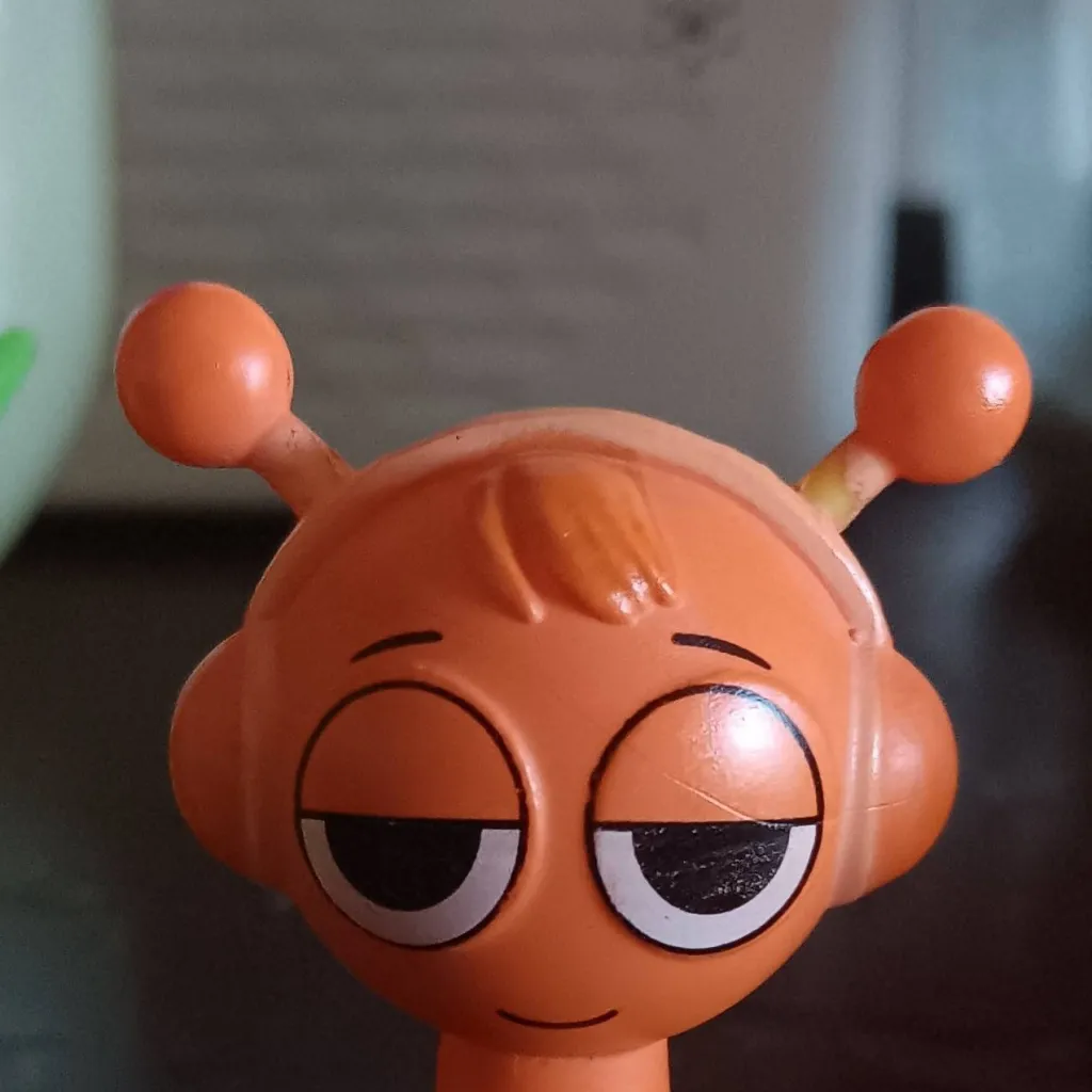 chat with ai character: Orange Toy