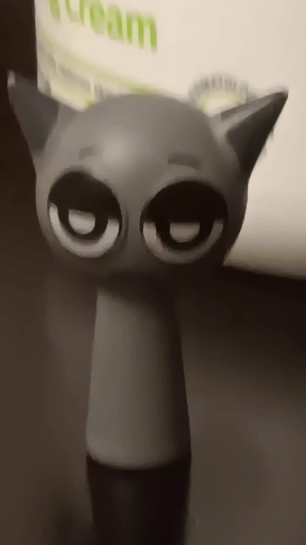 ai character: gray toy background