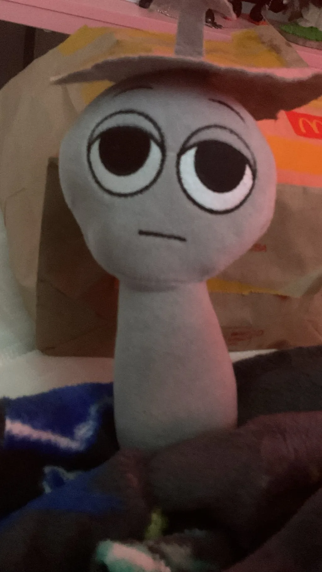 ai character: Clukr plushie background