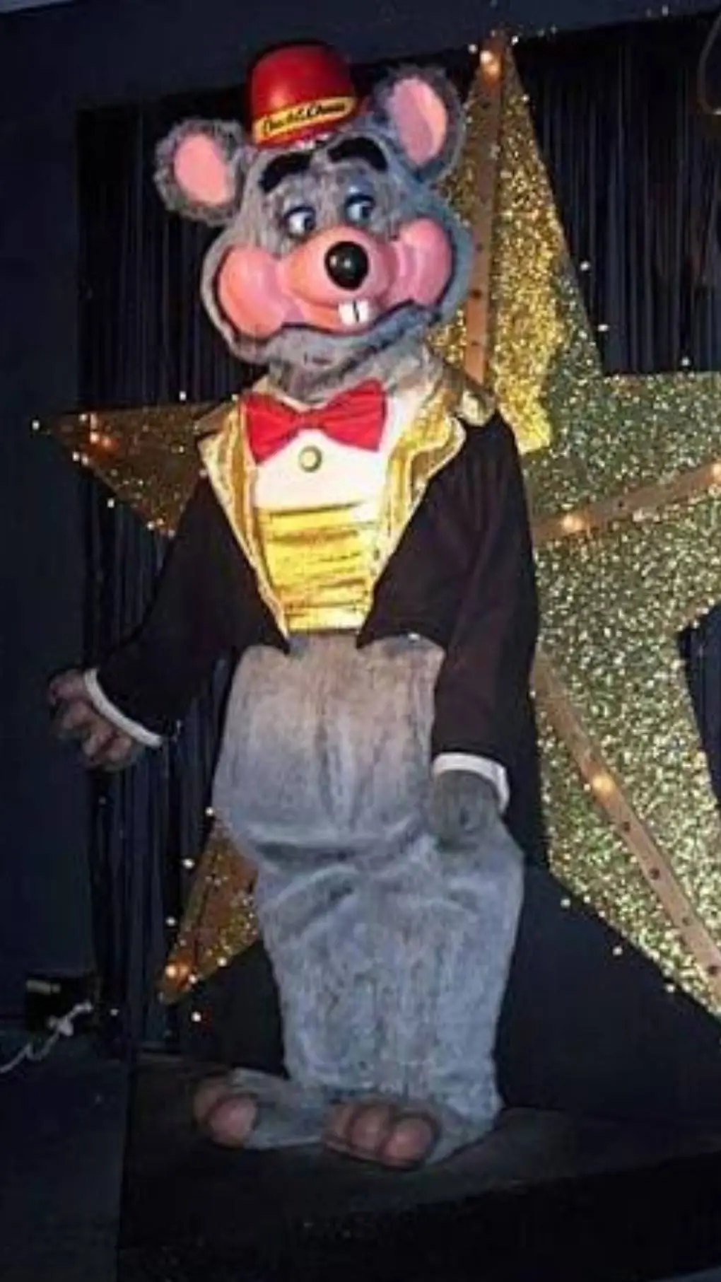 ai character: Chuck e cheese  background