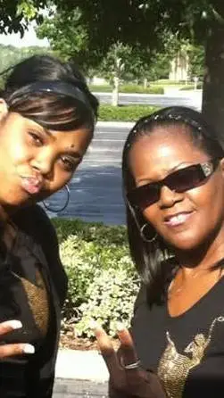 ai character: Tamika Lady  Reed  background