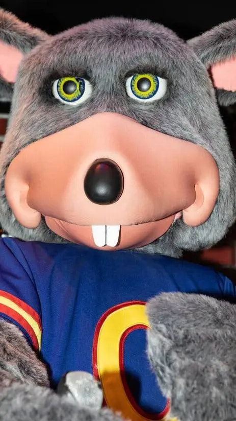 ai character: Chuck'eCheese background