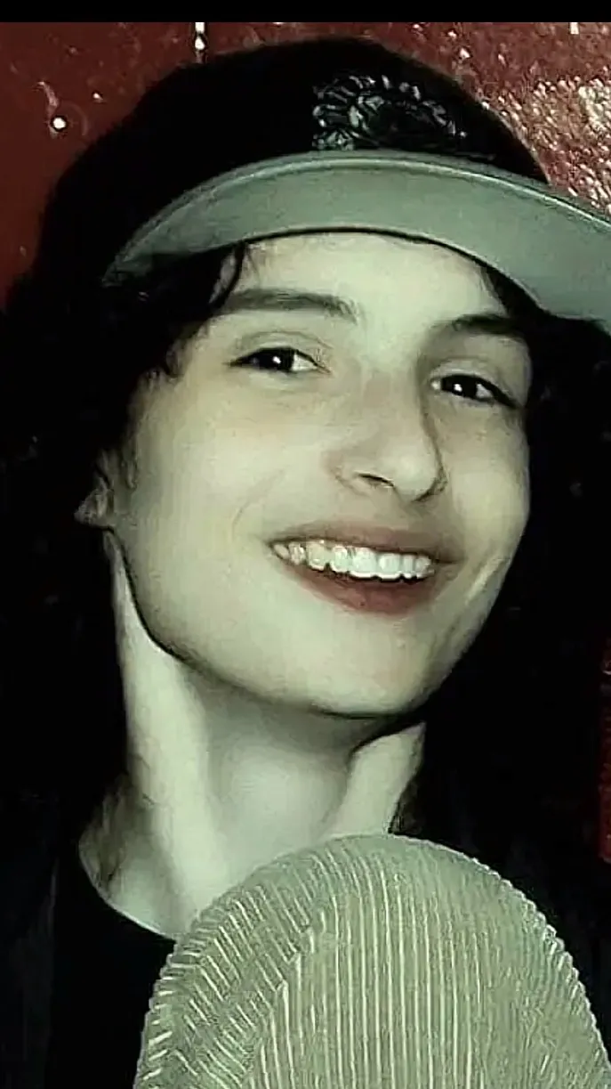 ai character: Finn Wolfhard  background