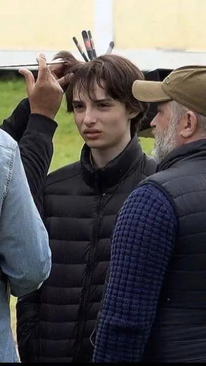 ai character: Finn Wolfhard  background