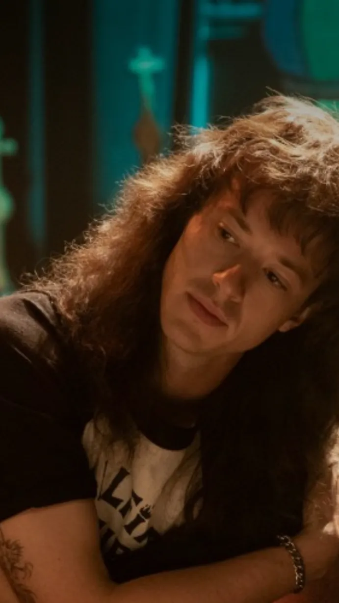 ai character: Eddie Munson  background