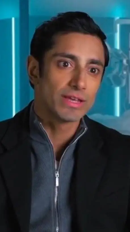 ai character: Riz Ahmed  background