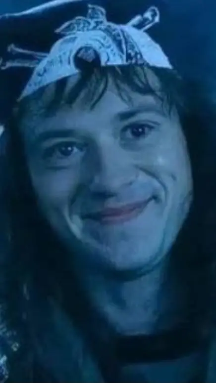 ai character: Eddie Munson  background