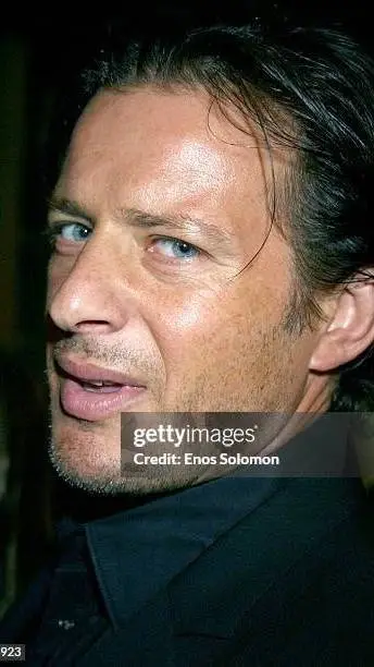 ai character: Costas Mandylor ♥️ background