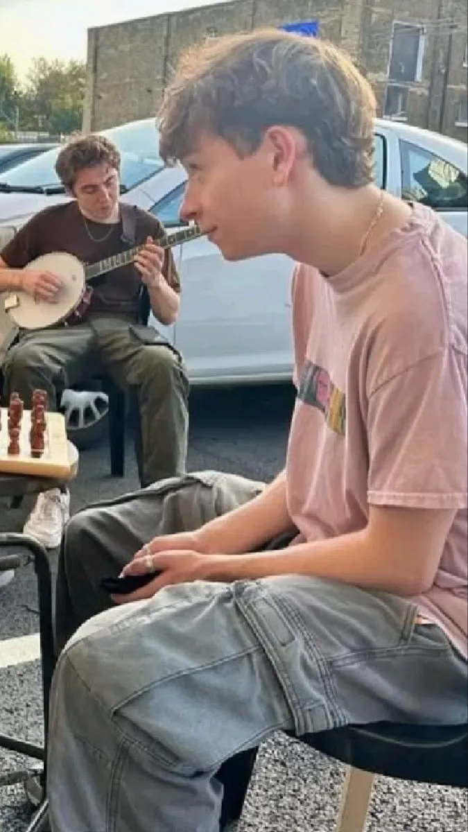 ai character: Louis McCartney  background