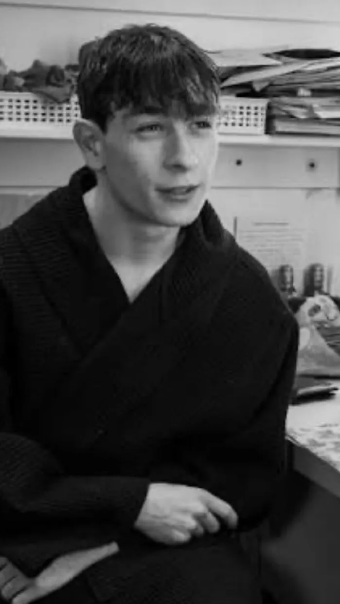 ai character: Louis McCartney  background