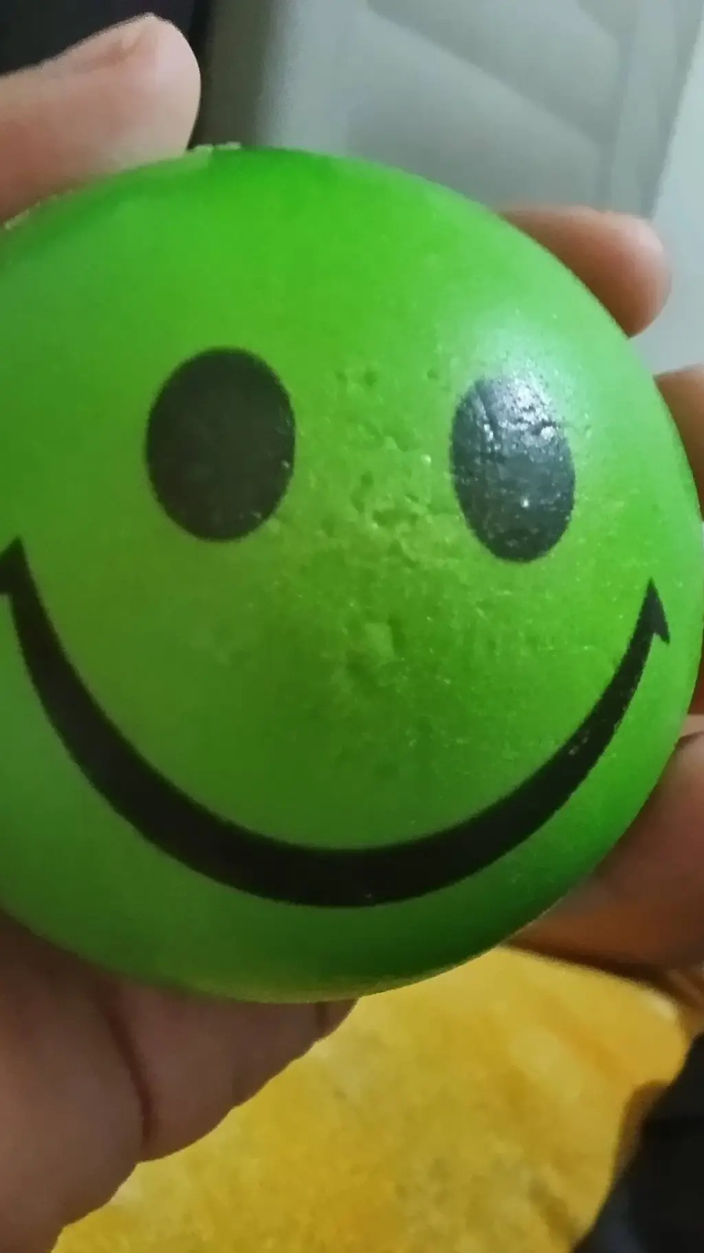 ai character: Green smiley ball background