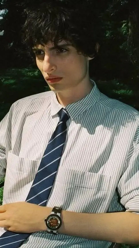 ai character: Finn Wolfhard  background