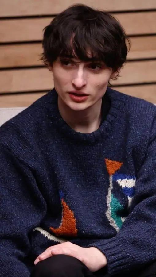 ai character: Finn Wolfhard  background