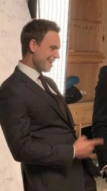 ai character: Patrick J Adams  background